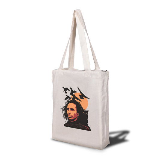 A tote bag with a graphic print of a person and ravens on a beige background.