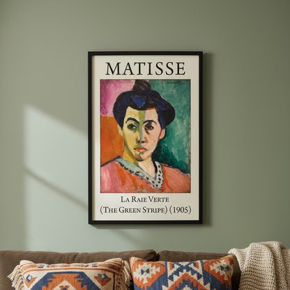 Framed Matisse artwork on a wall above a sofa with patterned cushions.