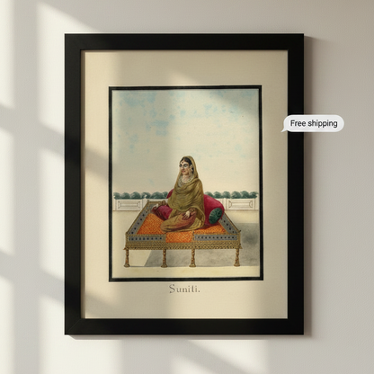 A framed art print featuring a vintage illustration of a woman seated on an ornate cushioned bed, with the label 'Suniti.' below.