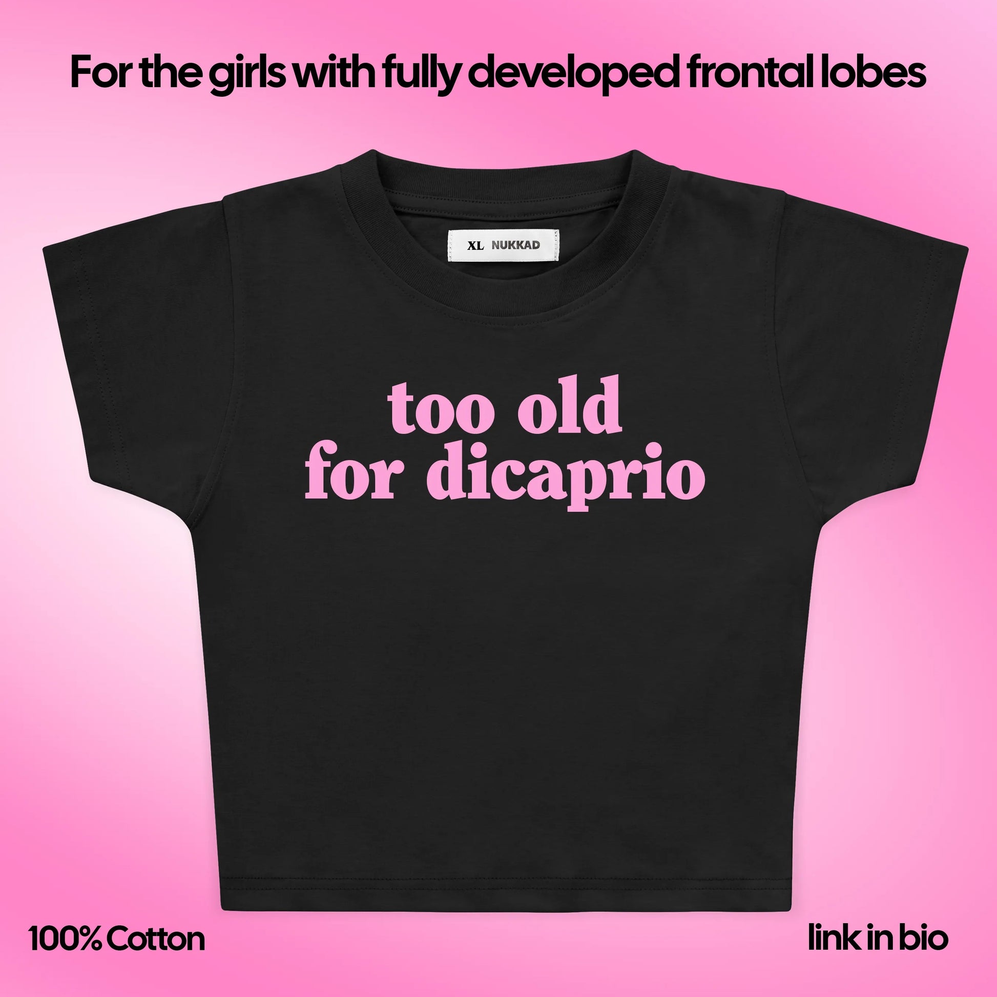 Black t-shirt with 'too old for dicaprio' text on a pink background