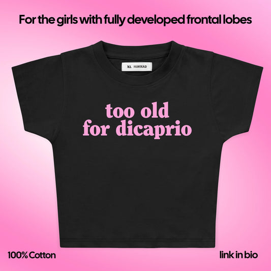 Black t-shirt with 'too old for dicaprio' text on a pink background