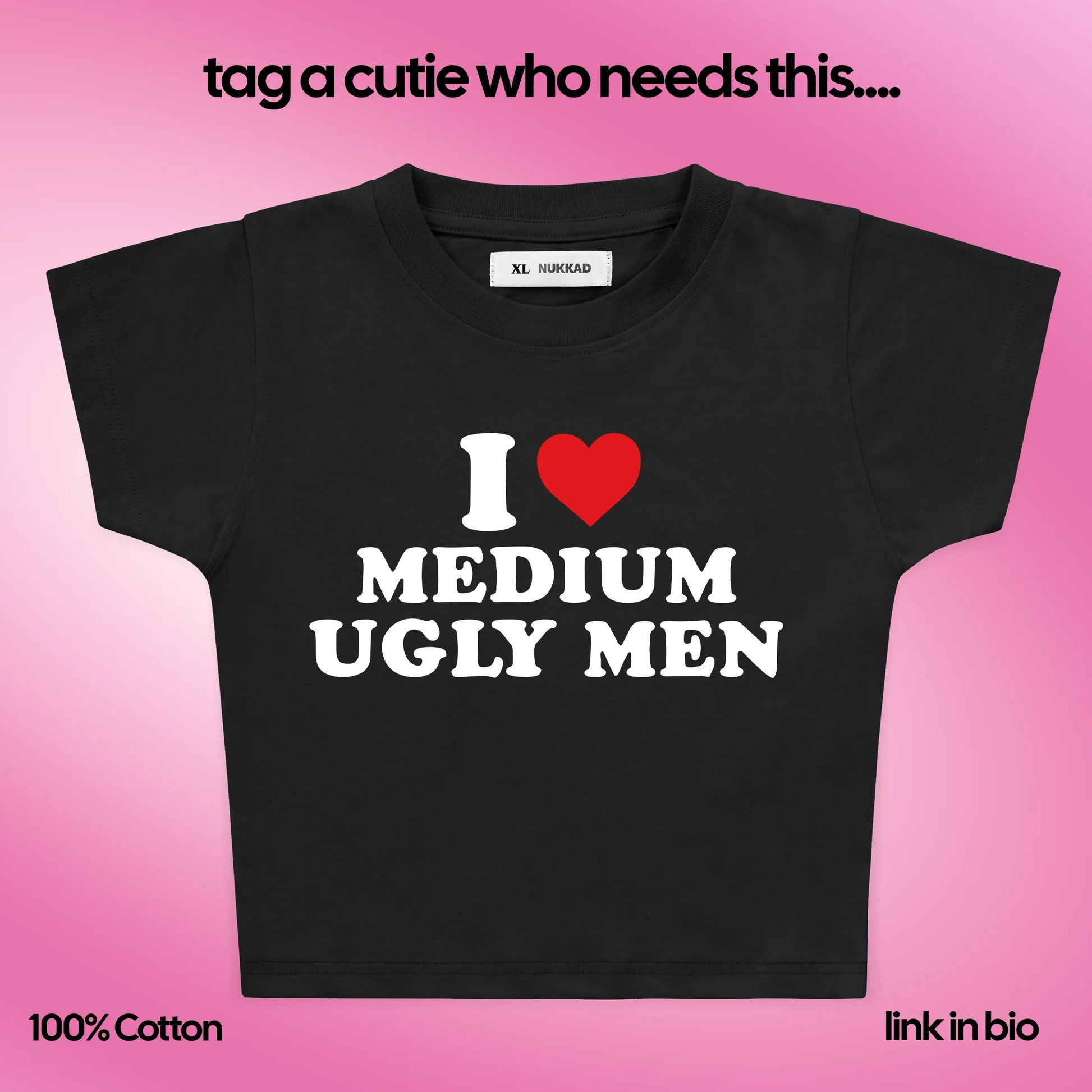 Black t-shirt with 'I ❤️ MEDIUM UGLY MEN' text on a pink background
