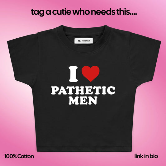 Black t-shirt with 'I ❤️ Pathetic Men' text on a pink background