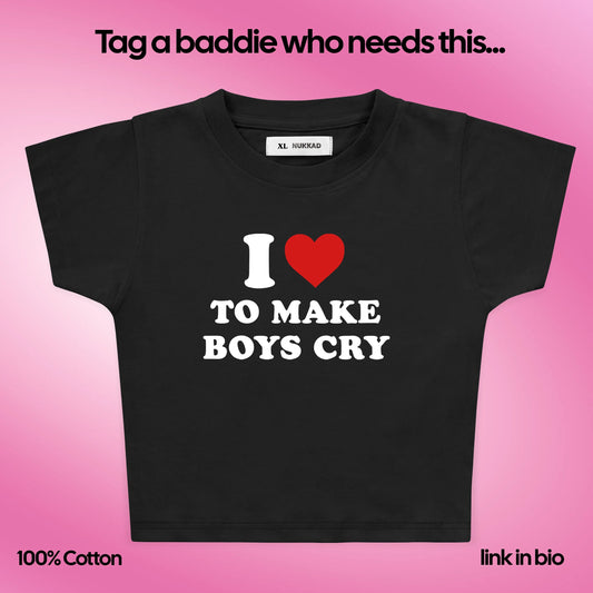 Black t-shirt with 'I ❤️ to make boys cry' text on a pink background
